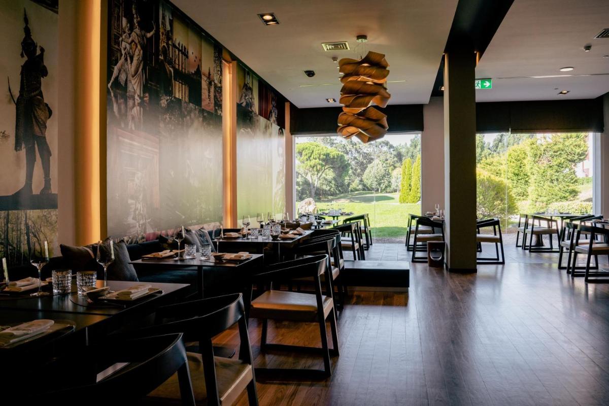 Um restaurante ou outro lugar para comer em Penha Longa Resort