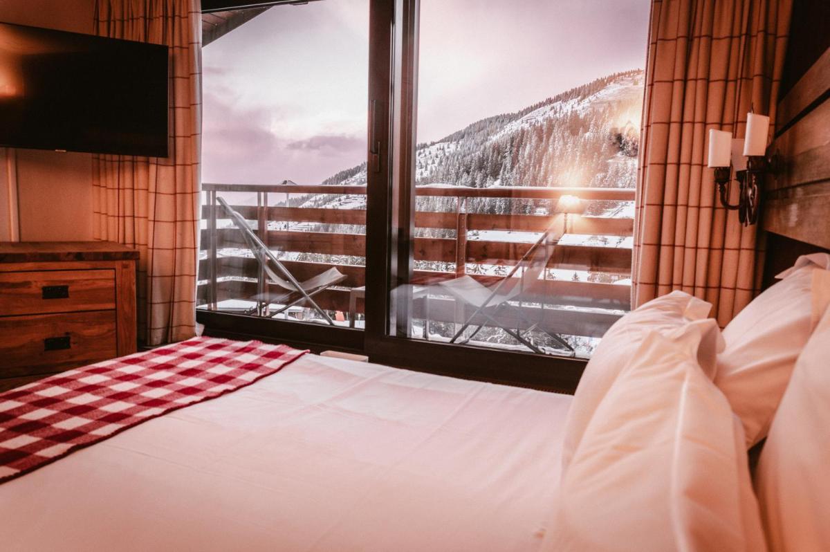 Un ou plusieurs lits dans un hébergement de l'établissement Hôtel Alpen Ruitor