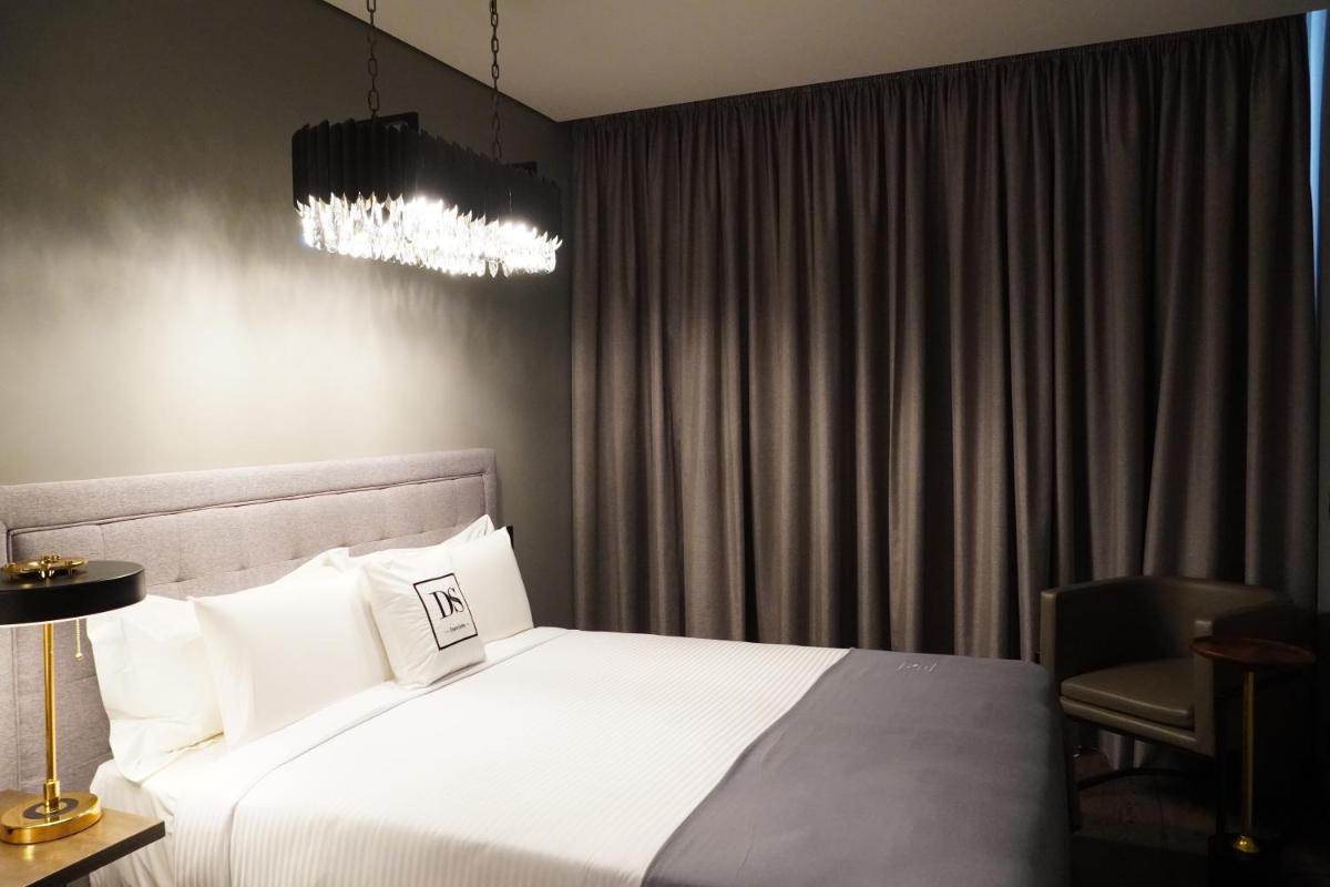 Uma cama ou camas num quarto em DS Hotel Lusopark