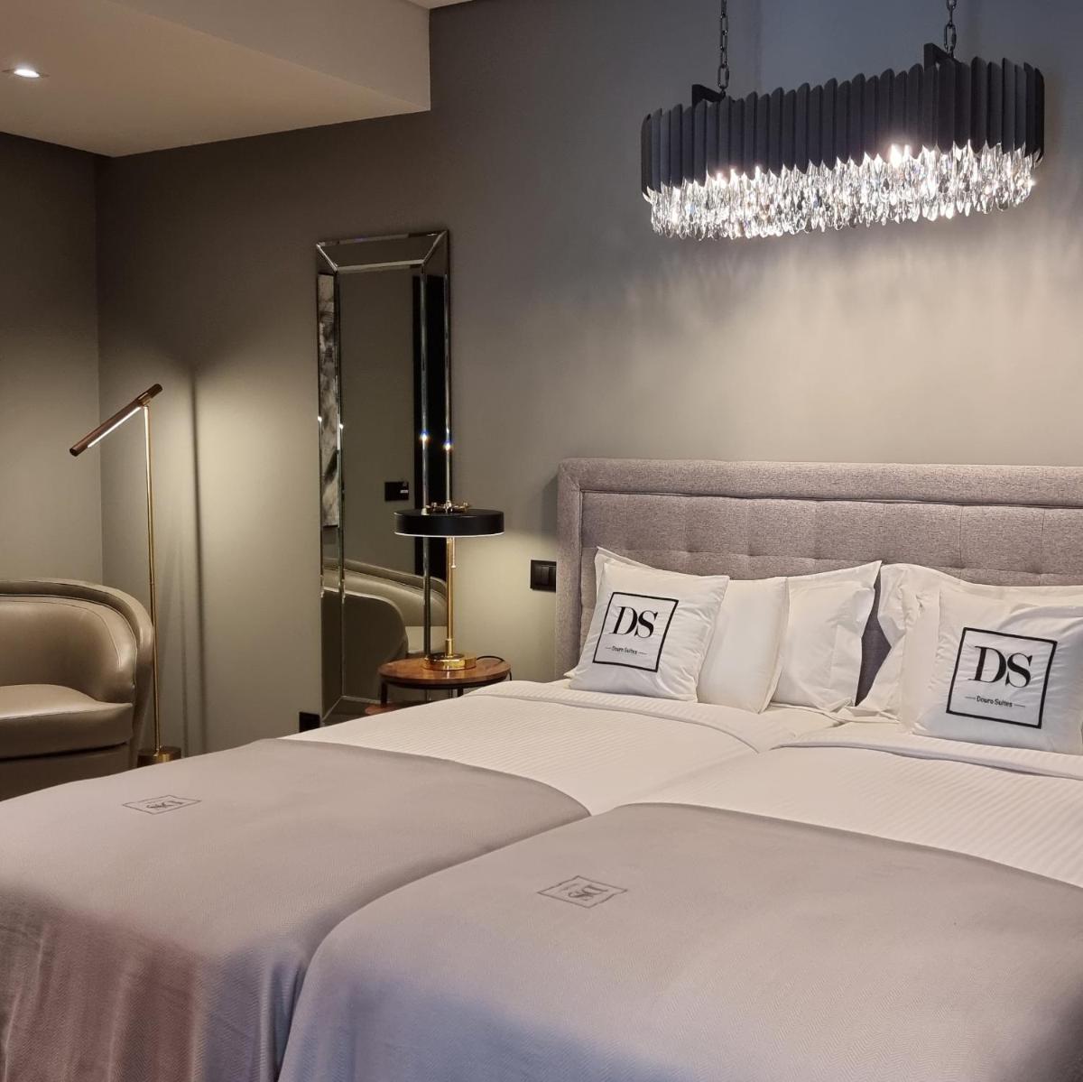 Uma cama ou camas num quarto em DS Hotel Lusopark