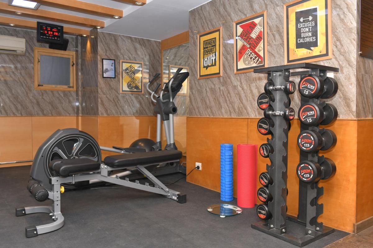 a fitness room with a gym with exercise equipment at Park Inn by Radisson,South Delhi in New Delhi a fitness room with a gym with exercise equipment at Park Inn by Radisson,South Delhi in New Delhi
