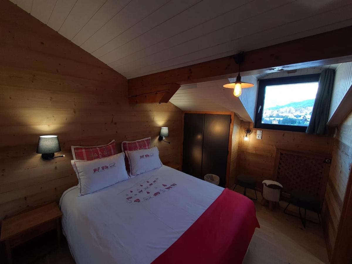 Un ou plusieurs lits dans un hébergement de l'établissement Café-Hôtel Le Morillon, Domaine du Grand Massif-Samoëns
