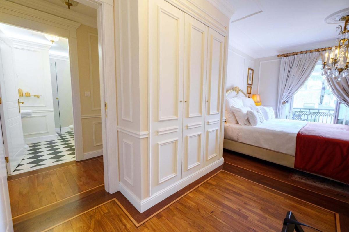 Uma cama ou camas num quarto em Boutique Hotel Teatro
