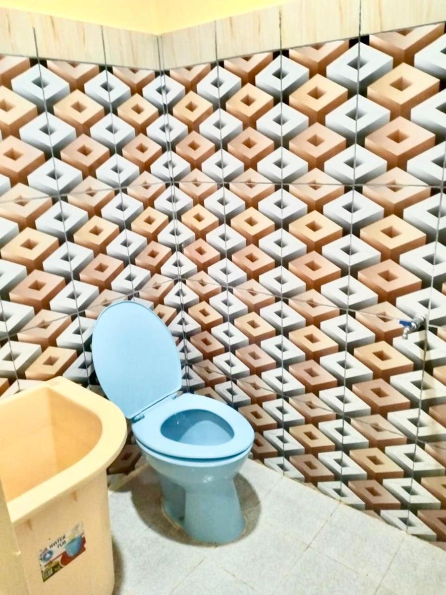 UNIQDO Inn Tomok - Housity