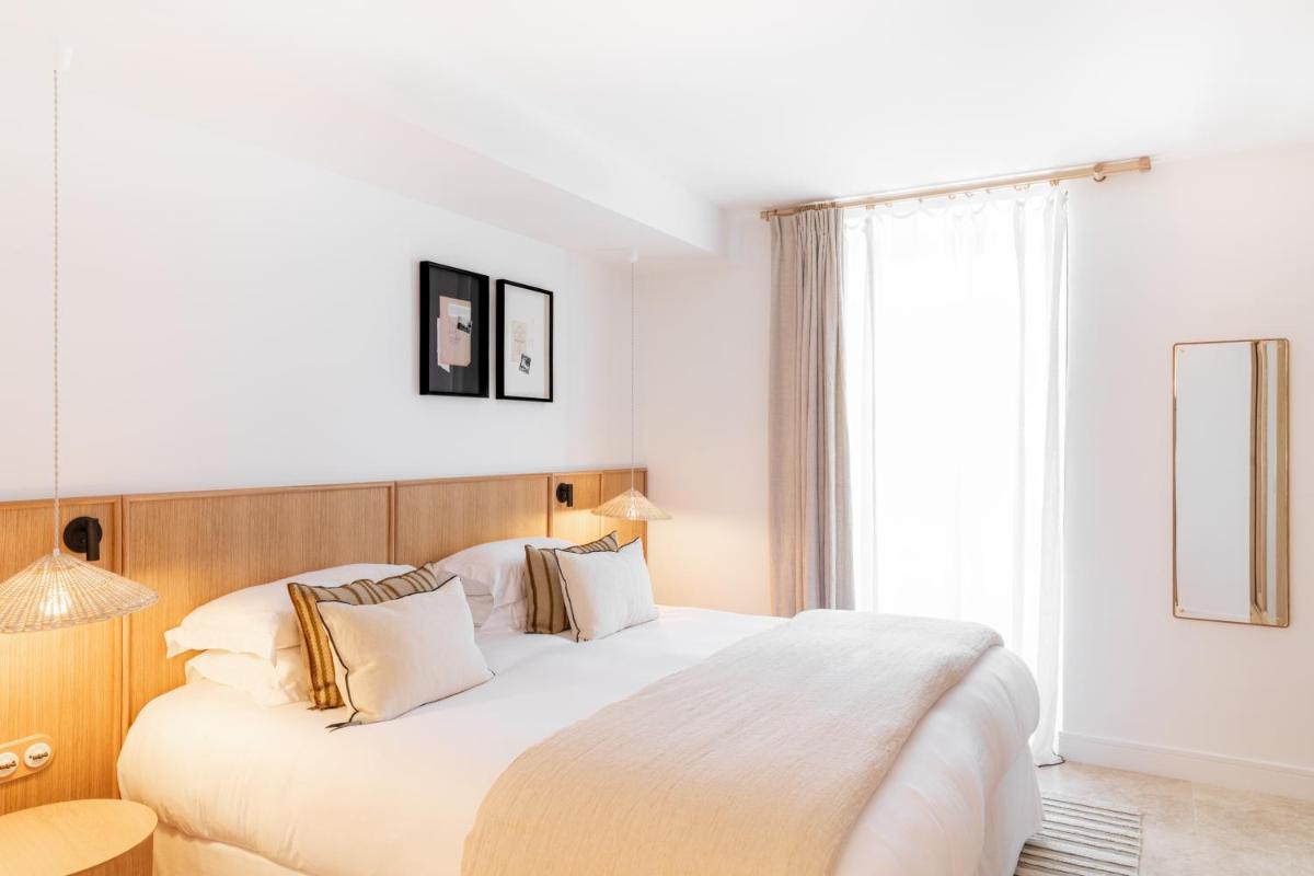 Un ou plusieurs lits dans un hébergement de l'établissement Le Couvent des Minimes, un Hôtel & Spa L'Occitane en Provence