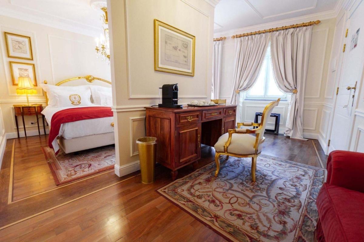 Uma cama ou camas num quarto em Boutique Hotel Teatro