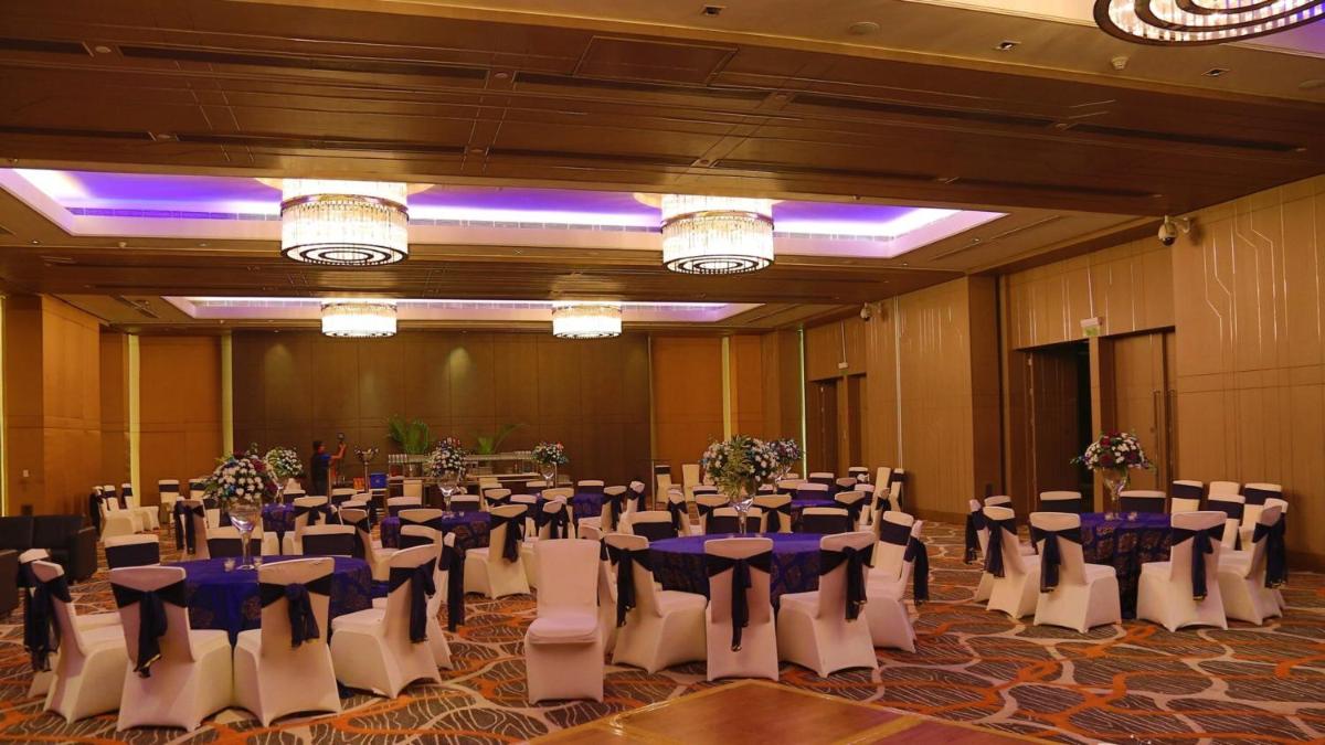 a banquet hall with tables and chairs in a room at Holiday Inn New Delhi Aerocity by IHG in New Delhi