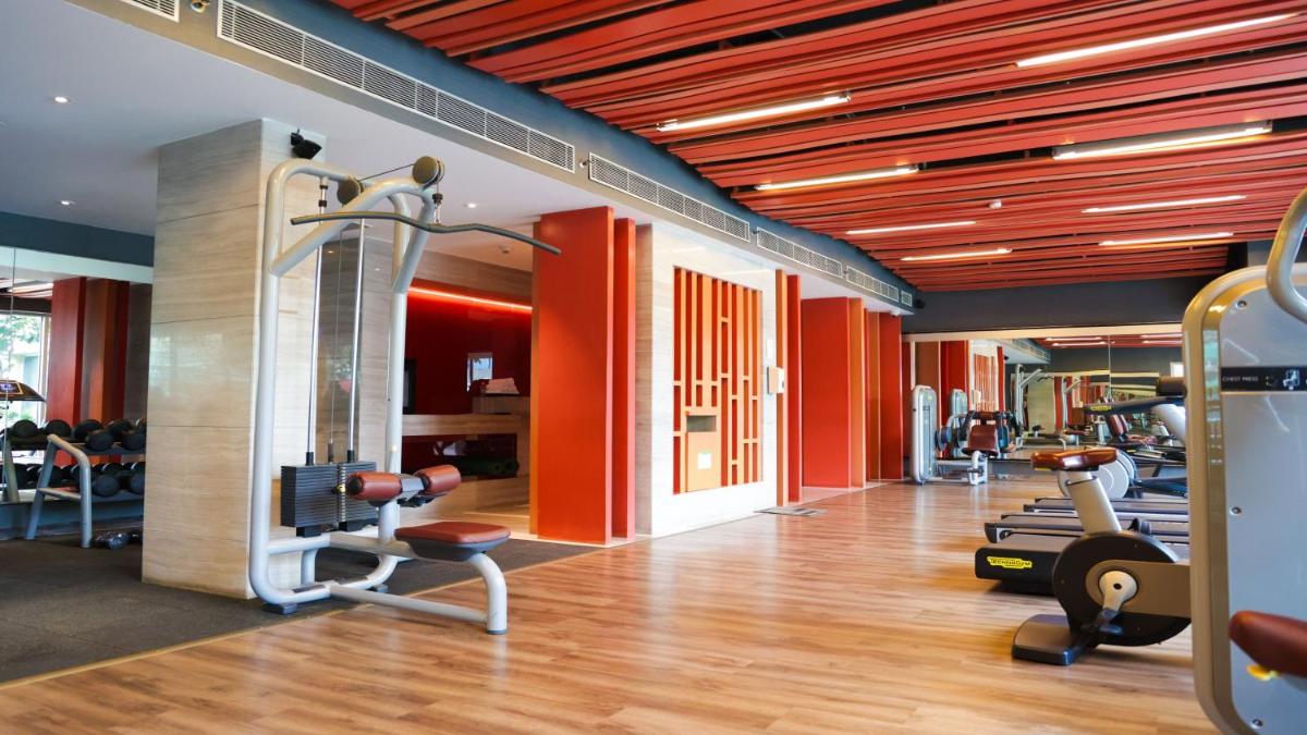 a gym with cardio equipment in a building at Holiday Inn New Delhi Aerocity by IHG in New Delhi