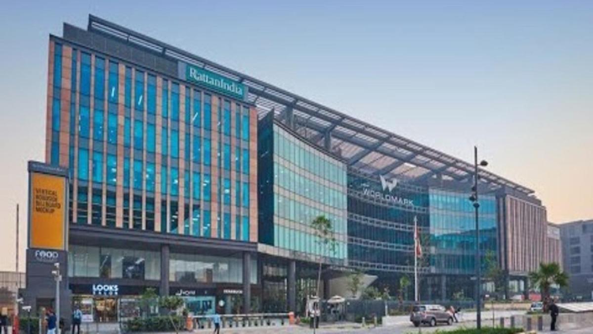 a large building with many windows in a city at Holiday Inn New Delhi Aerocity by IHG in New Delhi