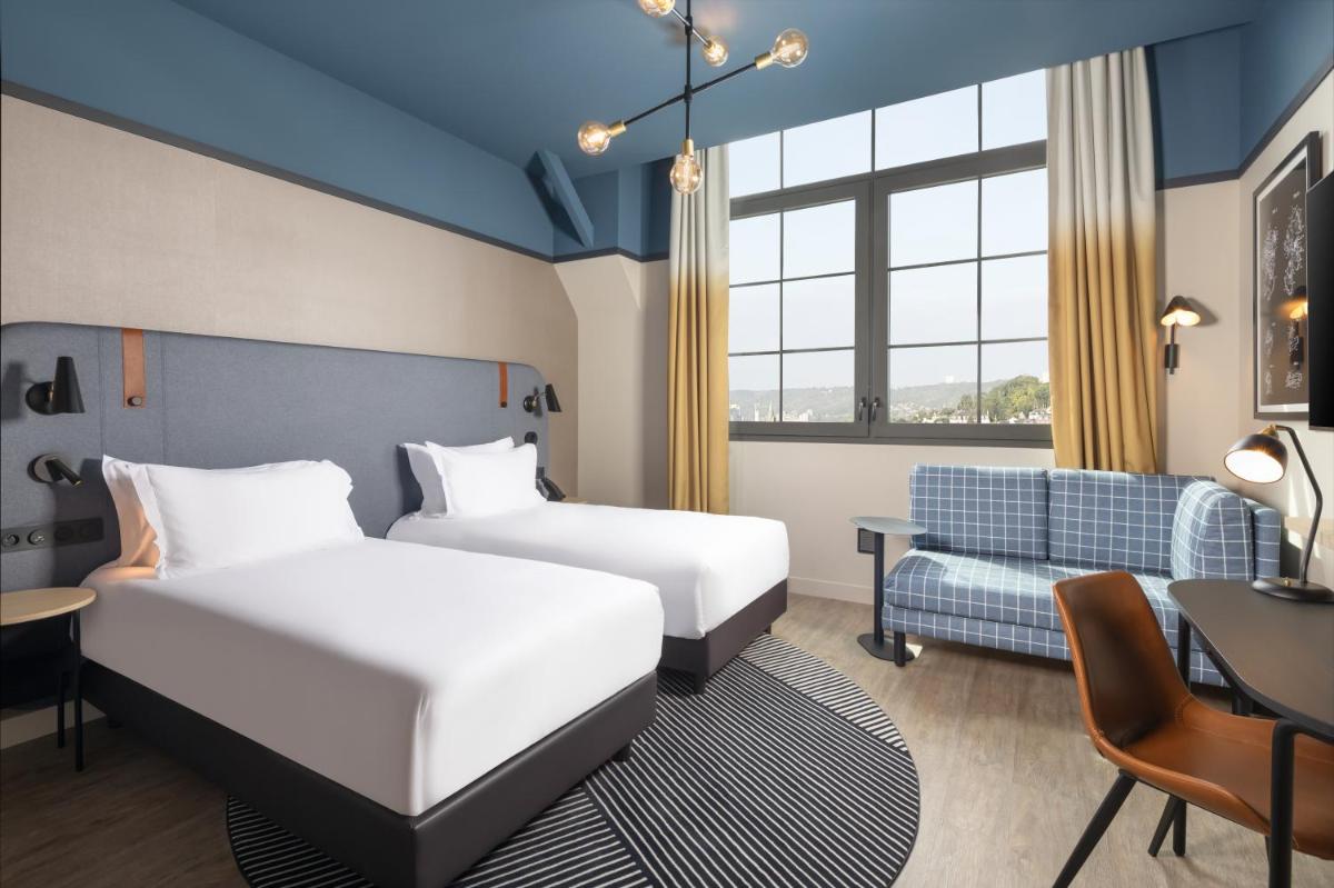 Un ou plusieurs lits dans un hébergement de l'établissement Hyatt Place Rouen