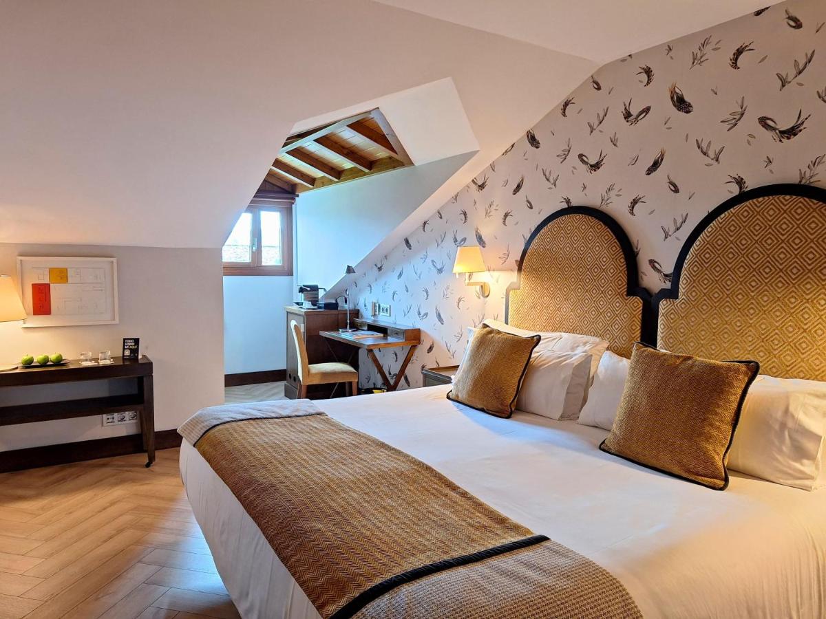 Cama o camas de una habitación en ARTIEM Asturias