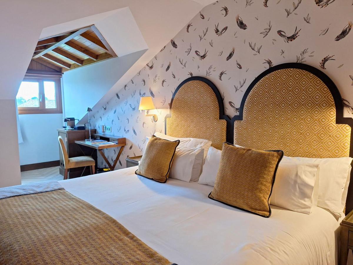 Cama o camas de una habitación en ARTIEM Asturias