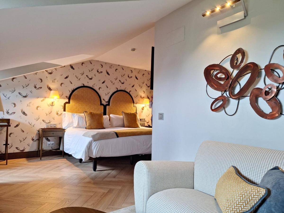 Cama o camas de una habitación en ARTIEM Asturias