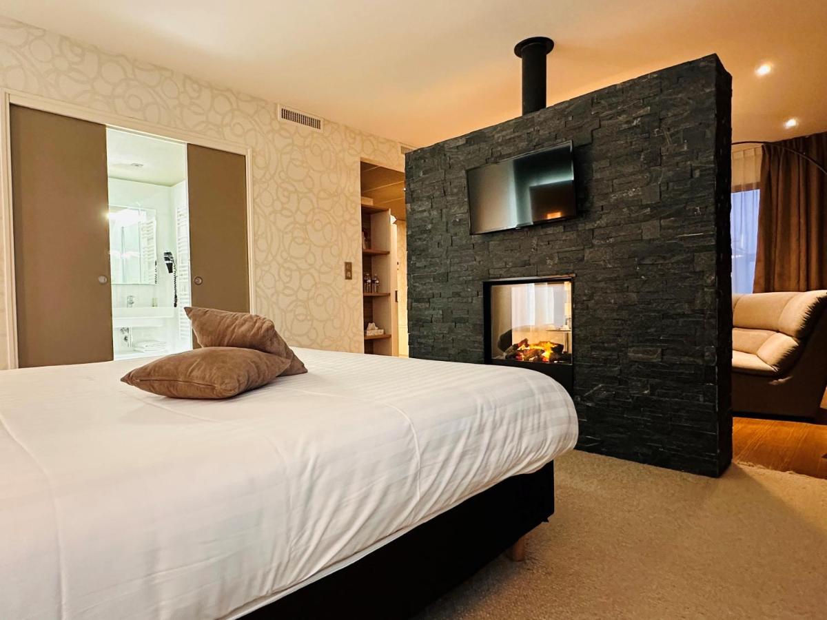 Un ou plusieurs lits dans un hébergement de l'établissement Brit Hotel & Spa Saint Brieuc Plérin