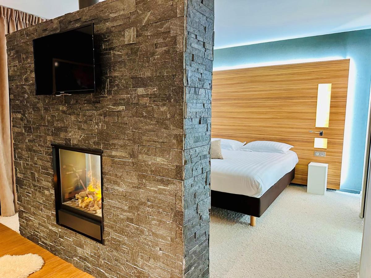 Un ou plusieurs lits dans un hébergement de l'établissement Brit Hotel & Spa Saint Brieuc Plérin
