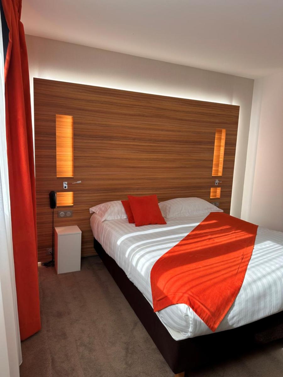 Un ou plusieurs lits dans un hébergement de l'établissement Brit Hotel & Spa Saint Brieuc Plérin