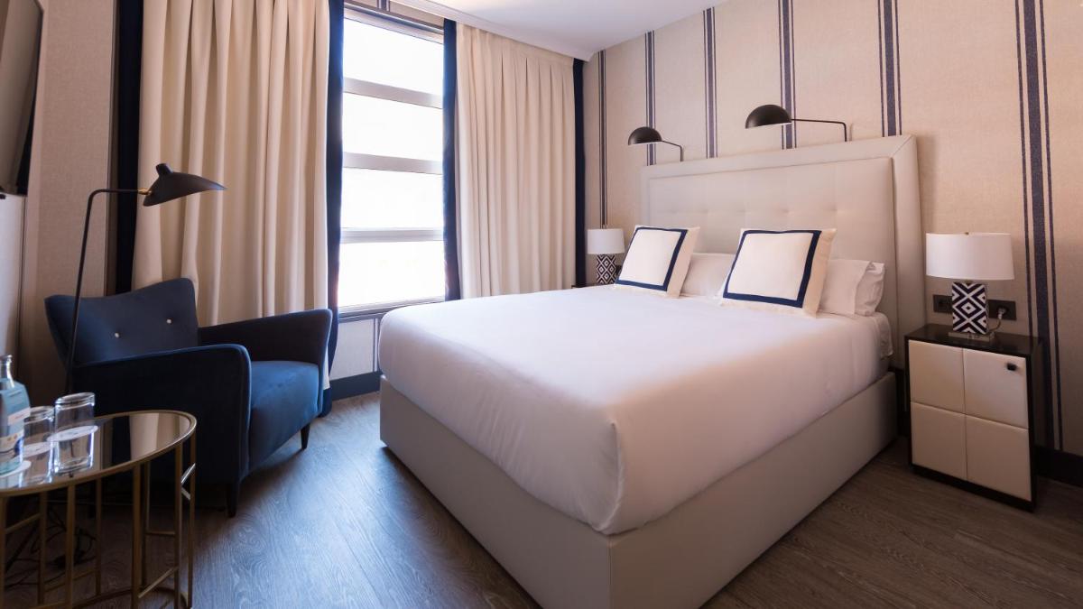 Cama o camas de una habitación en Hotel Mercure Jardines de Albia