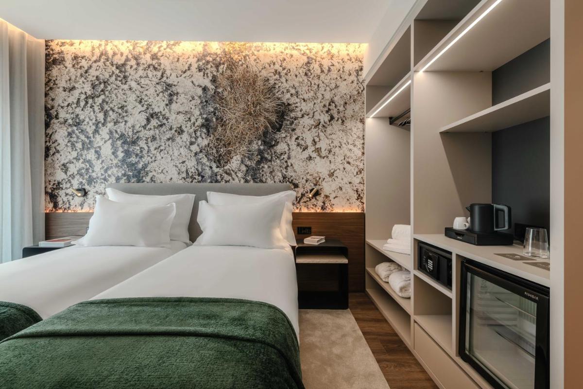 Uma cama ou camas num quarto em Dolinas Climbing Hotel