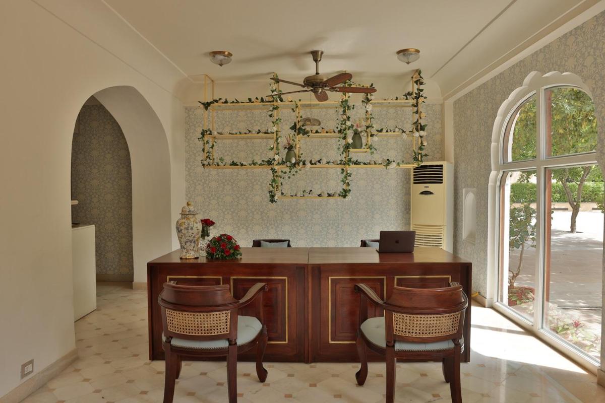 a home office with a desk and two chairs at Royal Heritage Haveli - By Leisure Hotels in Jaipur