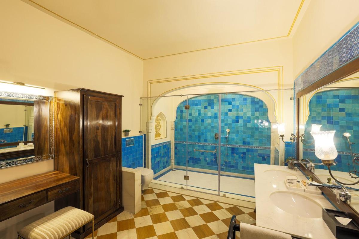 a bathroom with blue tiled walls and a sink at Royal Heritage Haveli - By Leisure Hotels in Jaipur