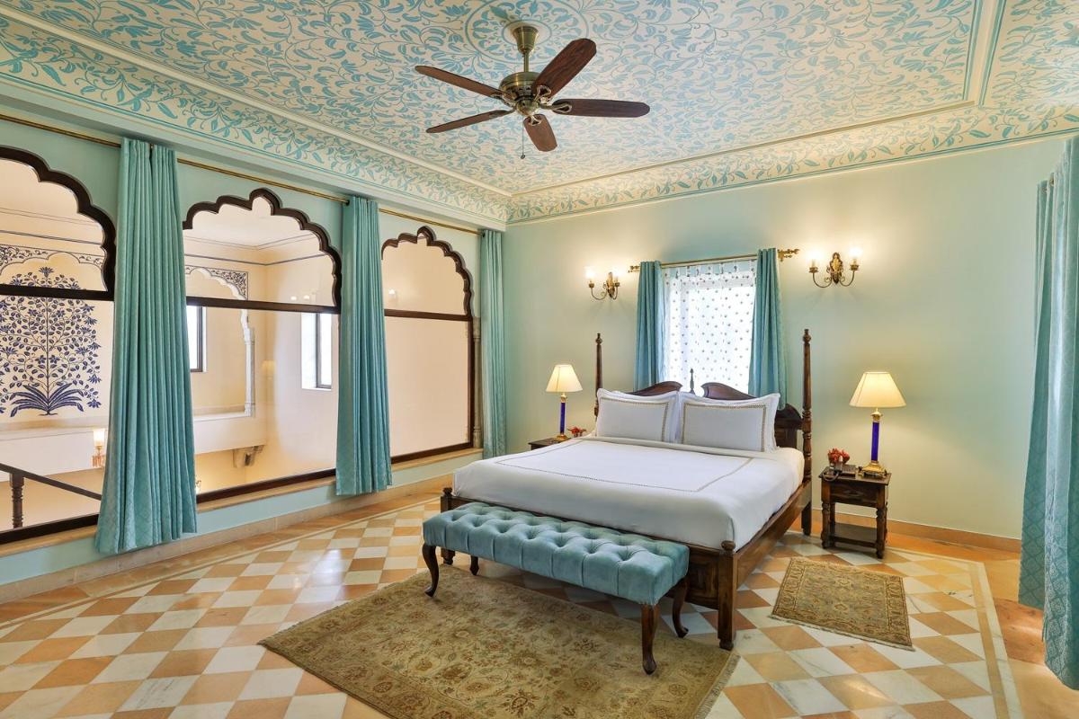 a bedroom with a bed and a ceiling at Royal Heritage Haveli - By Leisure Hotels in Jaipur