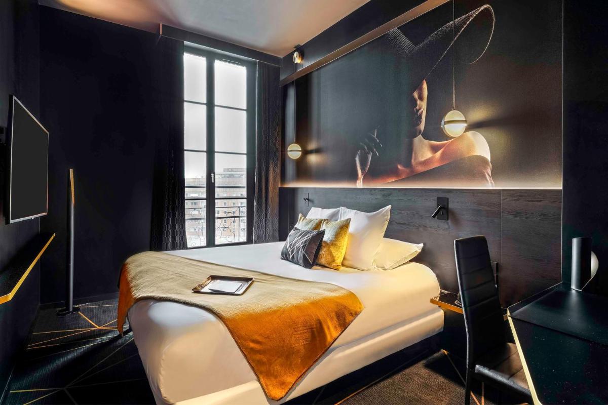 Un ou plusieurs lits dans un hébergement de l'établissement Hotel Leprince, Best Western Premier Collection