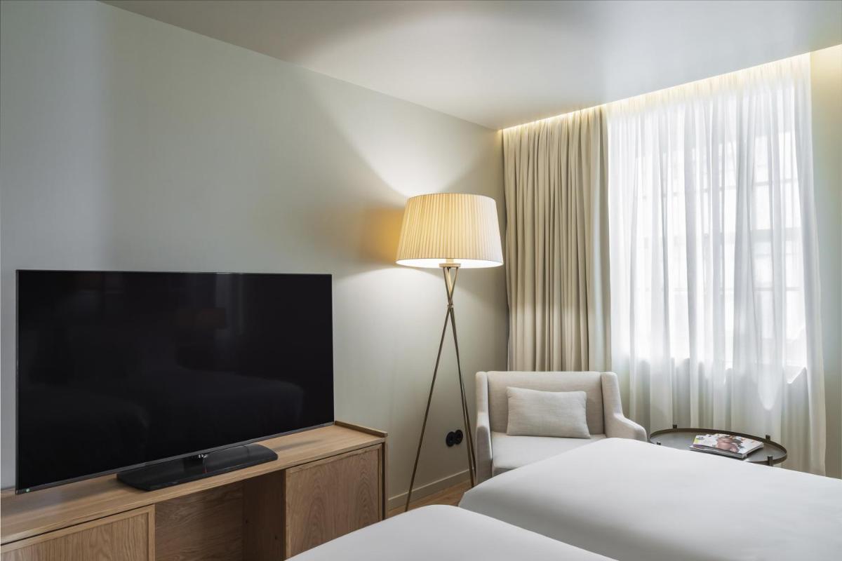 Uma cama ou camas num quarto em Casa da Companhia Hotel & Spa, Vignette Collection by IHG