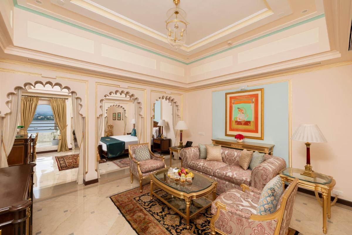 a living room with a couch and a table at Taj Fateh Prakash Palace Udaipur in Udaipur