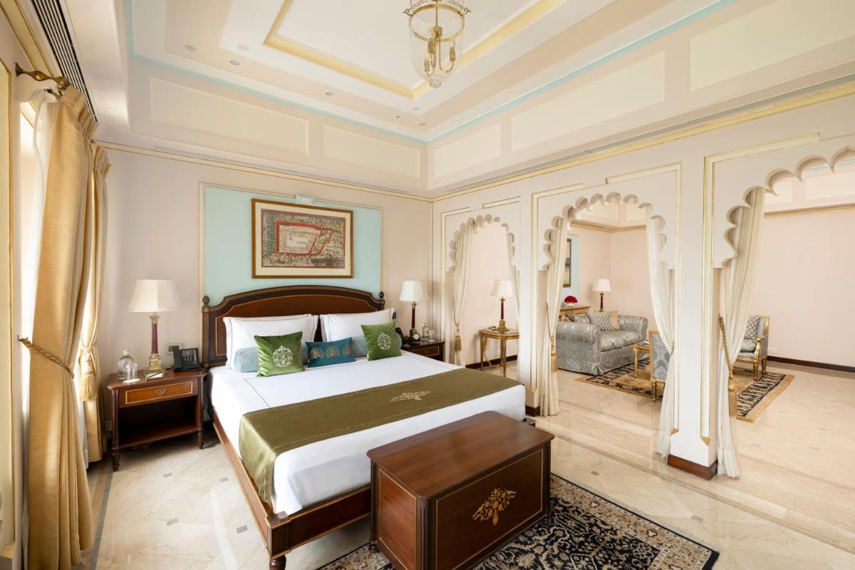 a bedroom with a large bed in a room at Taj Fateh Prakash Palace Udaipur in Udaipur