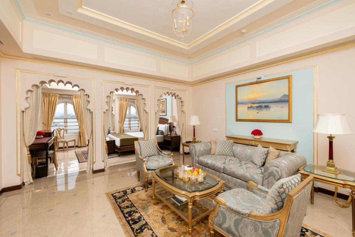 a living room with a couch and a table at Taj Fateh Prakash Palace Udaipur in Udaipur