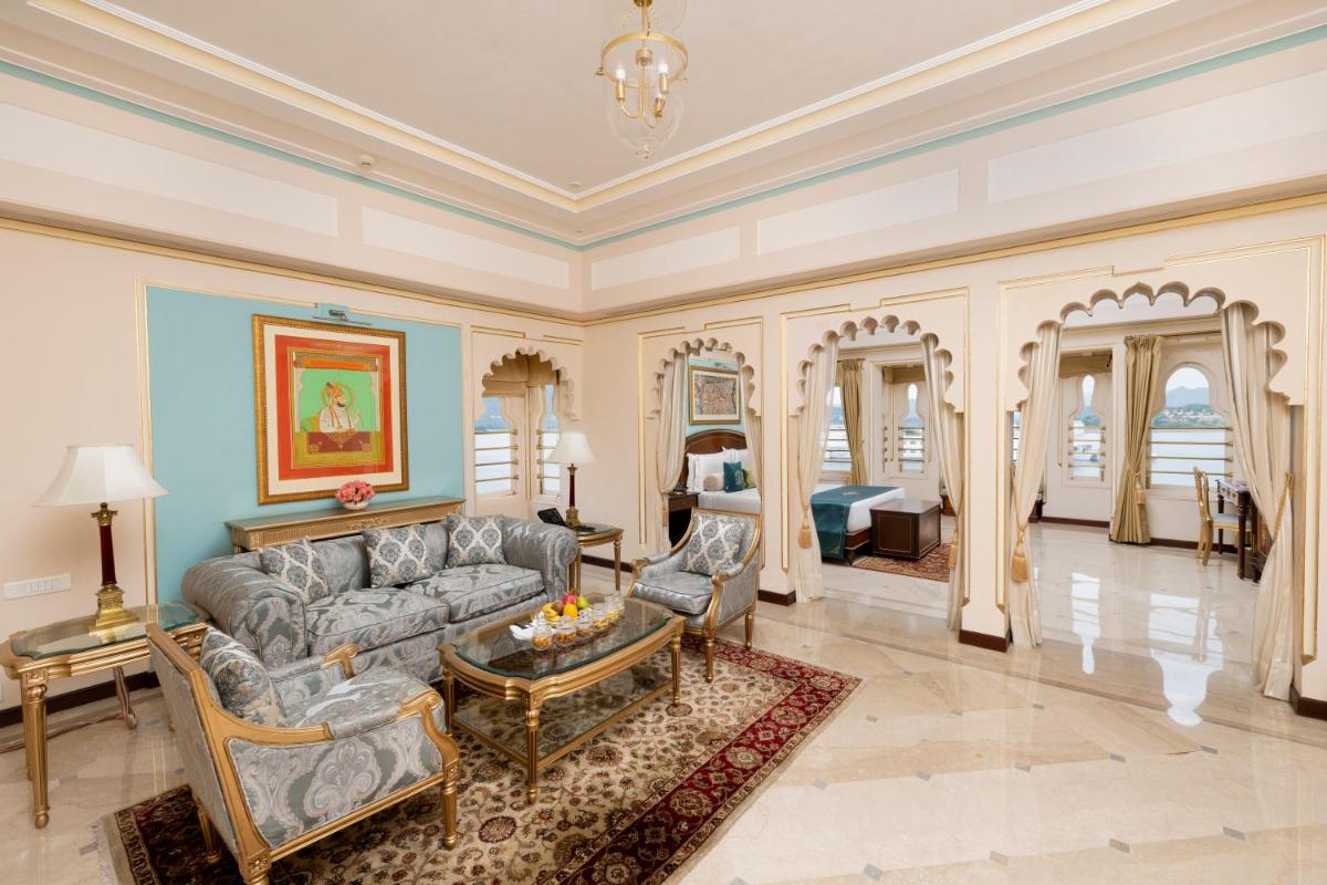 a living room with a couch and a table at Taj Fateh Prakash Palace Udaipur in Udaipur