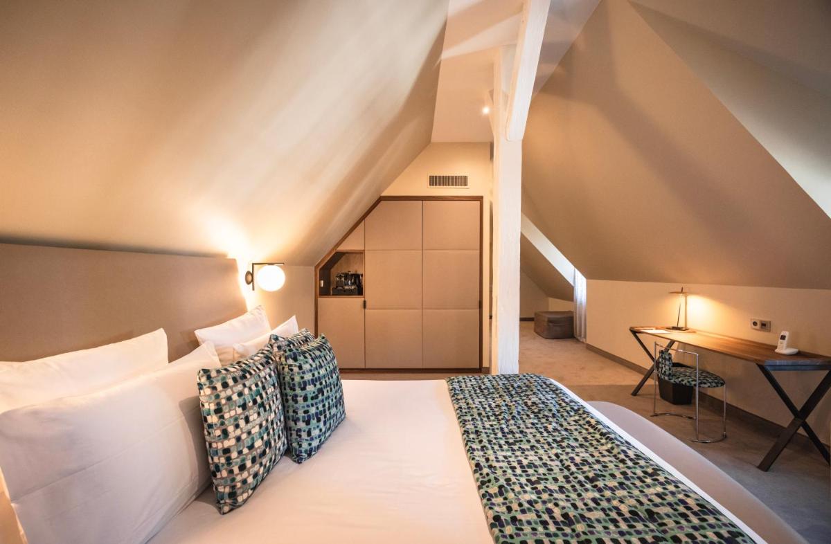 Un ou plusieurs lits dans un hébergement de l'établissement Hotel & Spa REGENT PETITE FRANCE