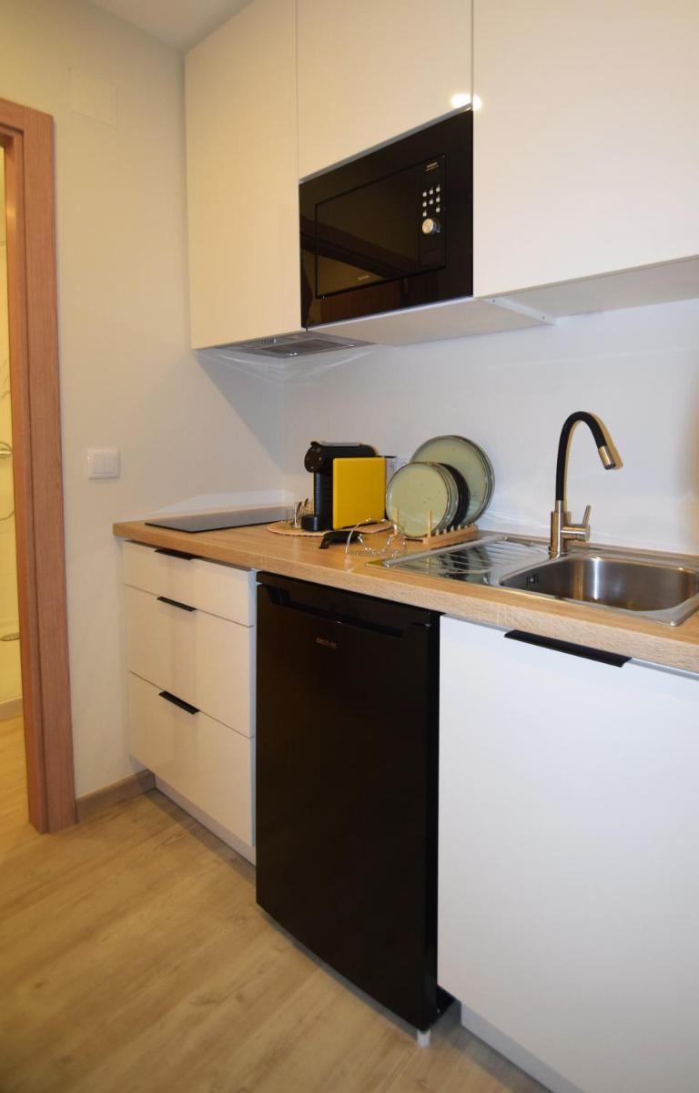 A cozinha ou kitchenette de SIENNA Hotel