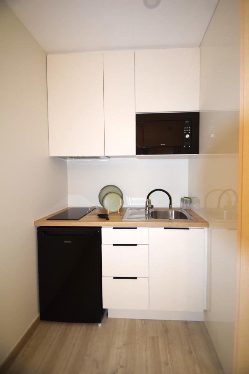 A cozinha ou kitchenette de SIENNA Hotel