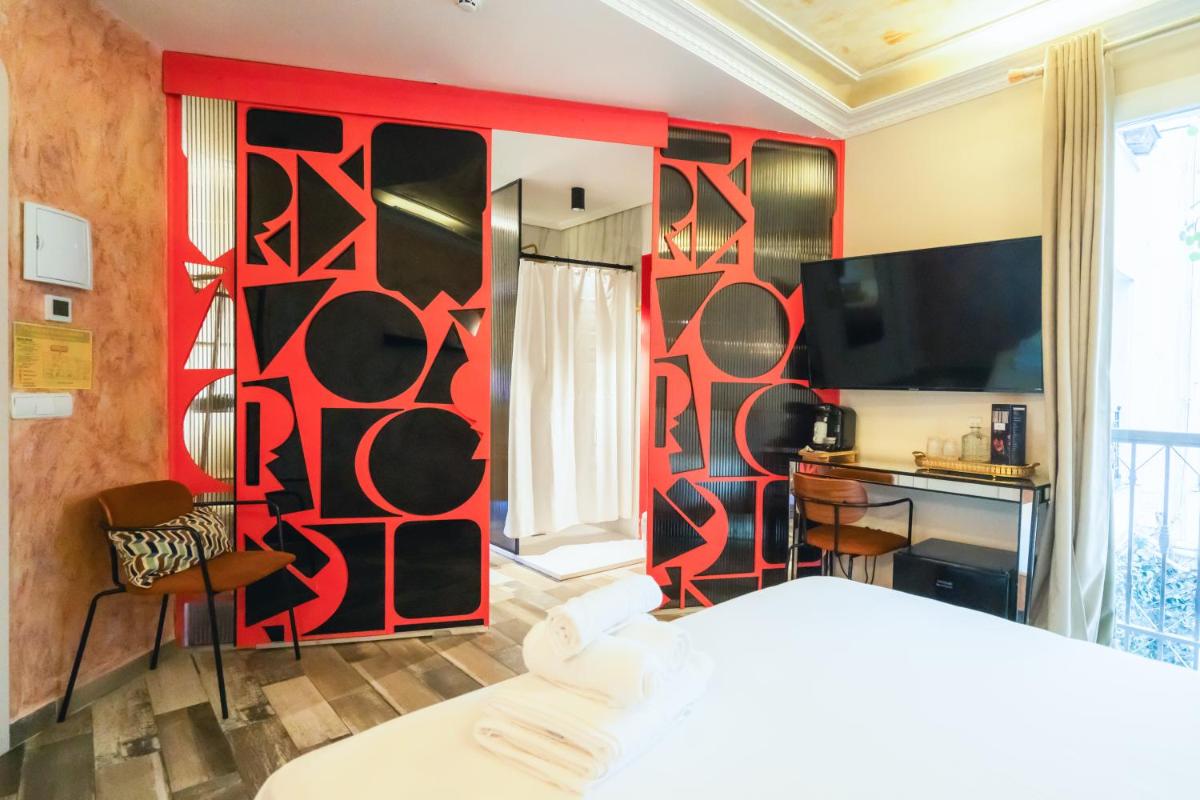 Cama o camas de una habitación en Abalú Design Boutique Hotel Gran Via