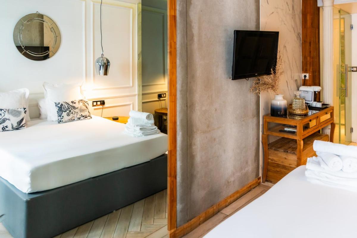 Cama o camas de una habitación en Abalú Design Boutique Hotel Gran Via