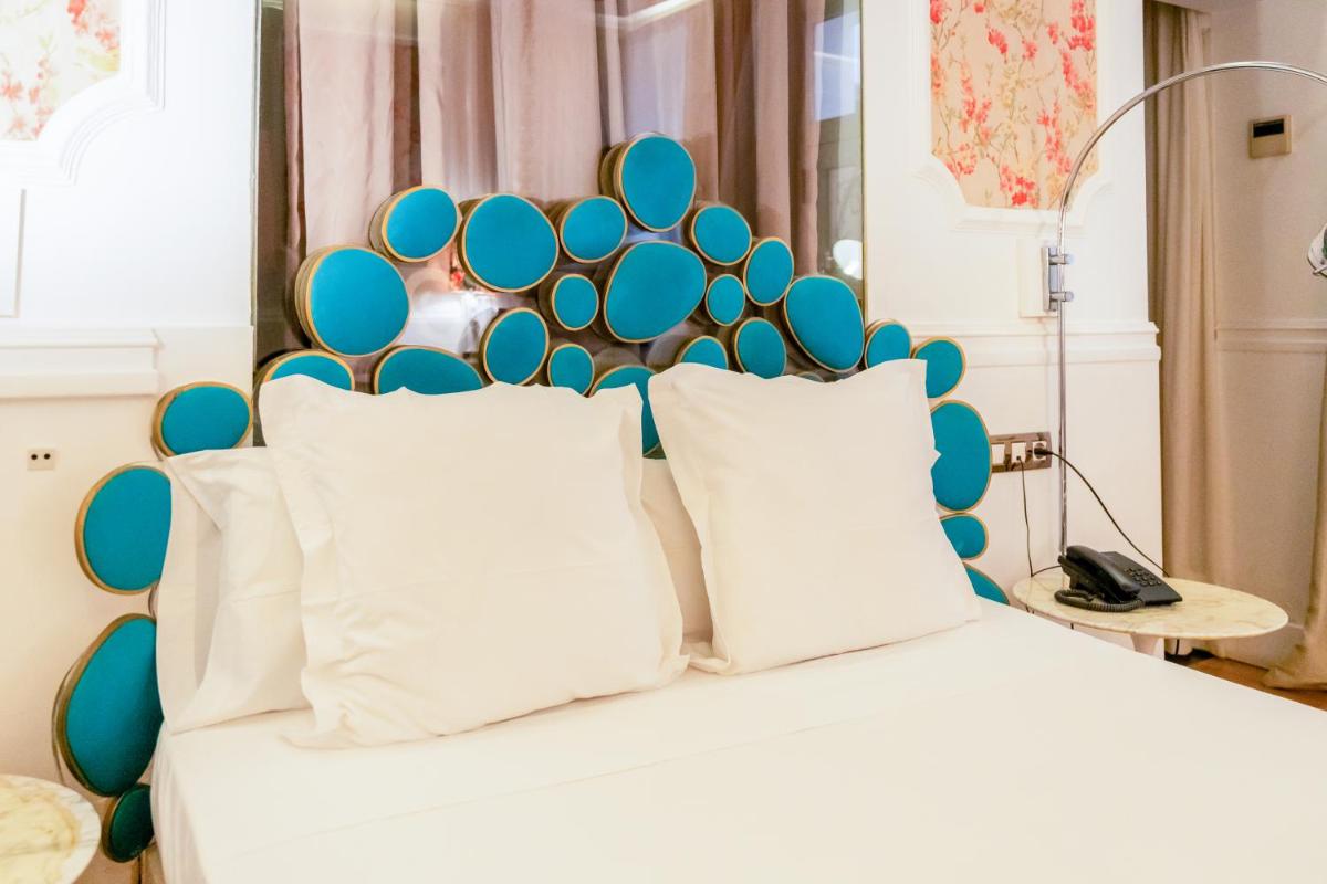 Cama o camas de una habitación en Abalú Design Boutique Hotel Gran Via