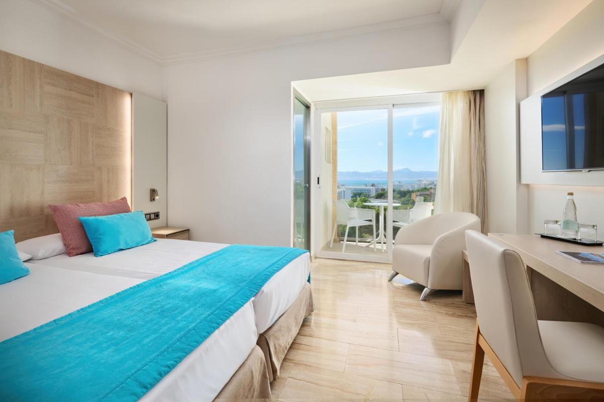 Cama o camas de una habitación en Grupotel Orient