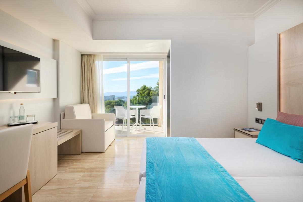 Cama o camas de una habitación en Grupotel Orient