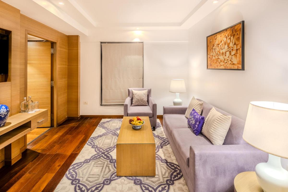 a living room with a couch and a table at Vivanta Goa, Panaji in Panaji a living room with a couch and a table at Vivanta Goa, Panaji in Panaji