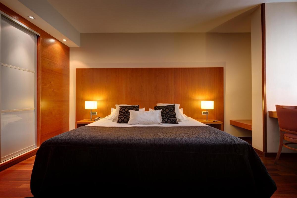 Cama o camas de una habitación en Acevi Villarroel