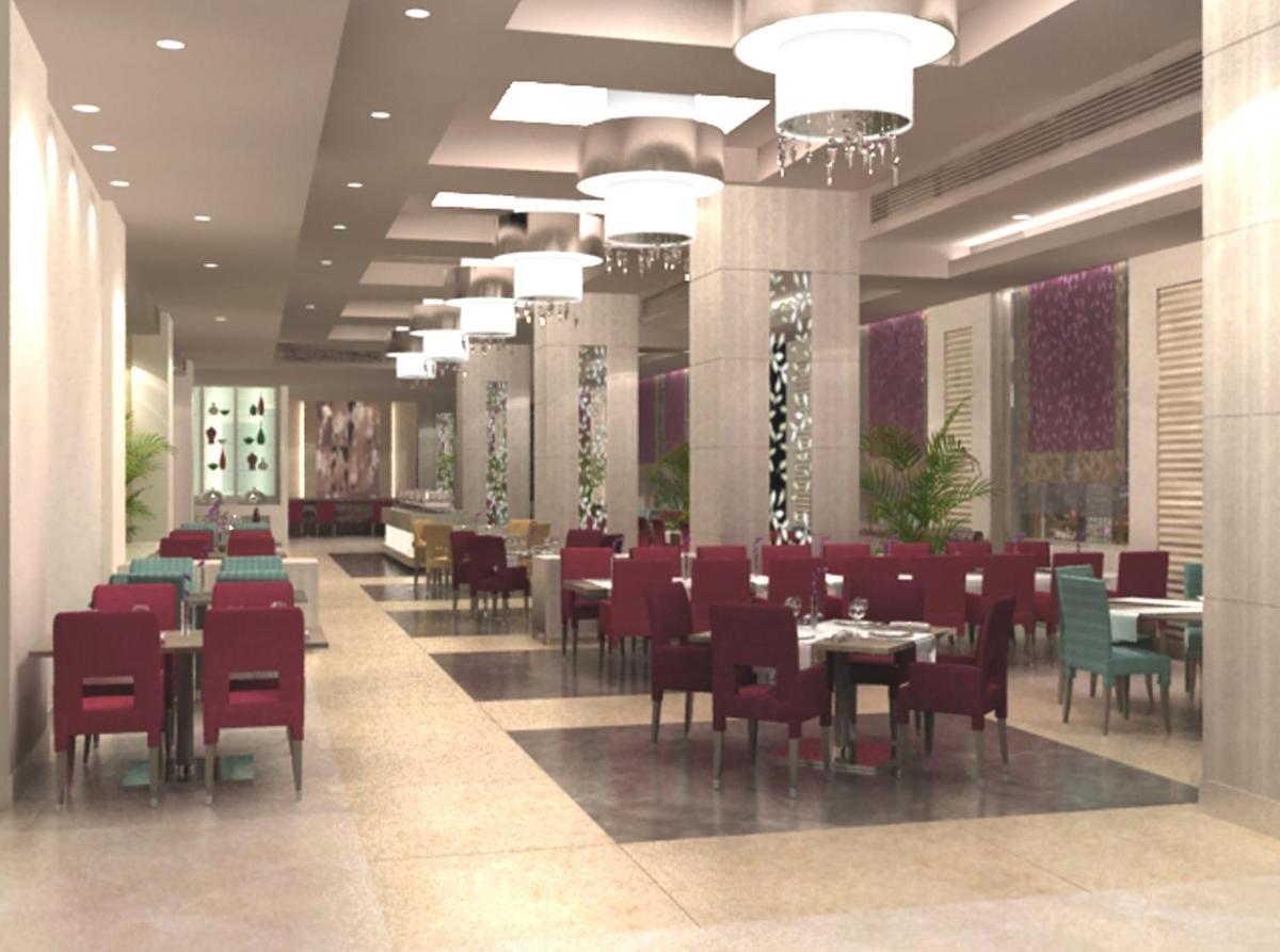 a rendering of a restaurant with tables and chairs at Radisson Hyderabad Hitec City in Hyderabad