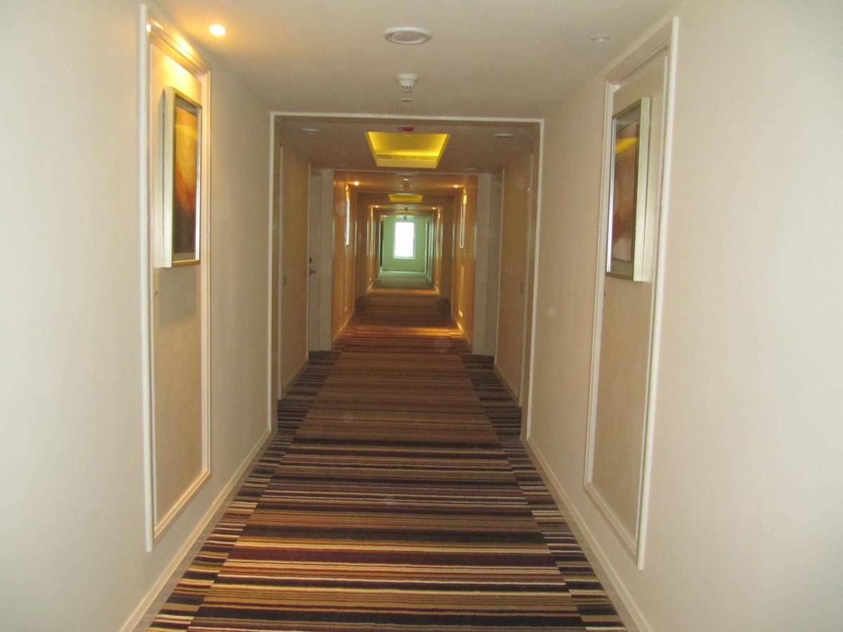 a hallway of a hotel with a long corridor at Radisson Hyderabad Hitec City in Hyderabad