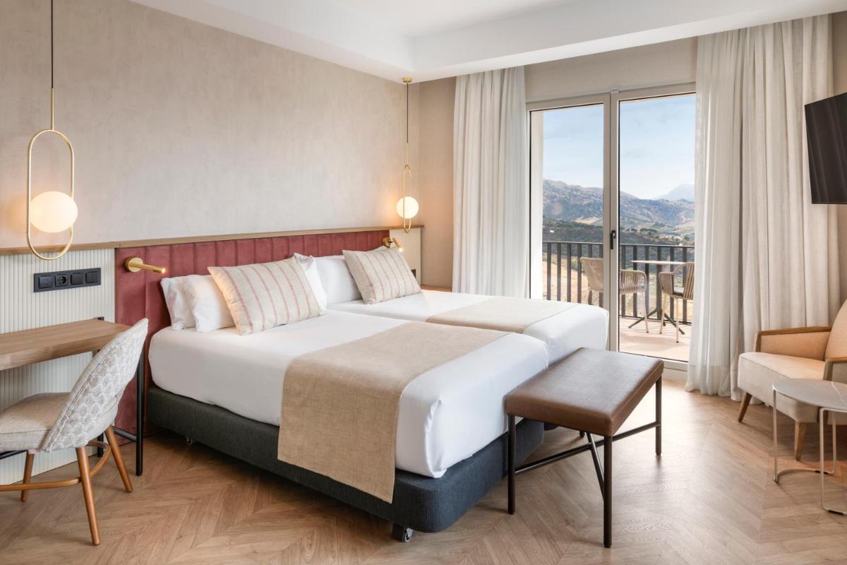Cama o camas de una habitación en Catalonia Reina Victoria