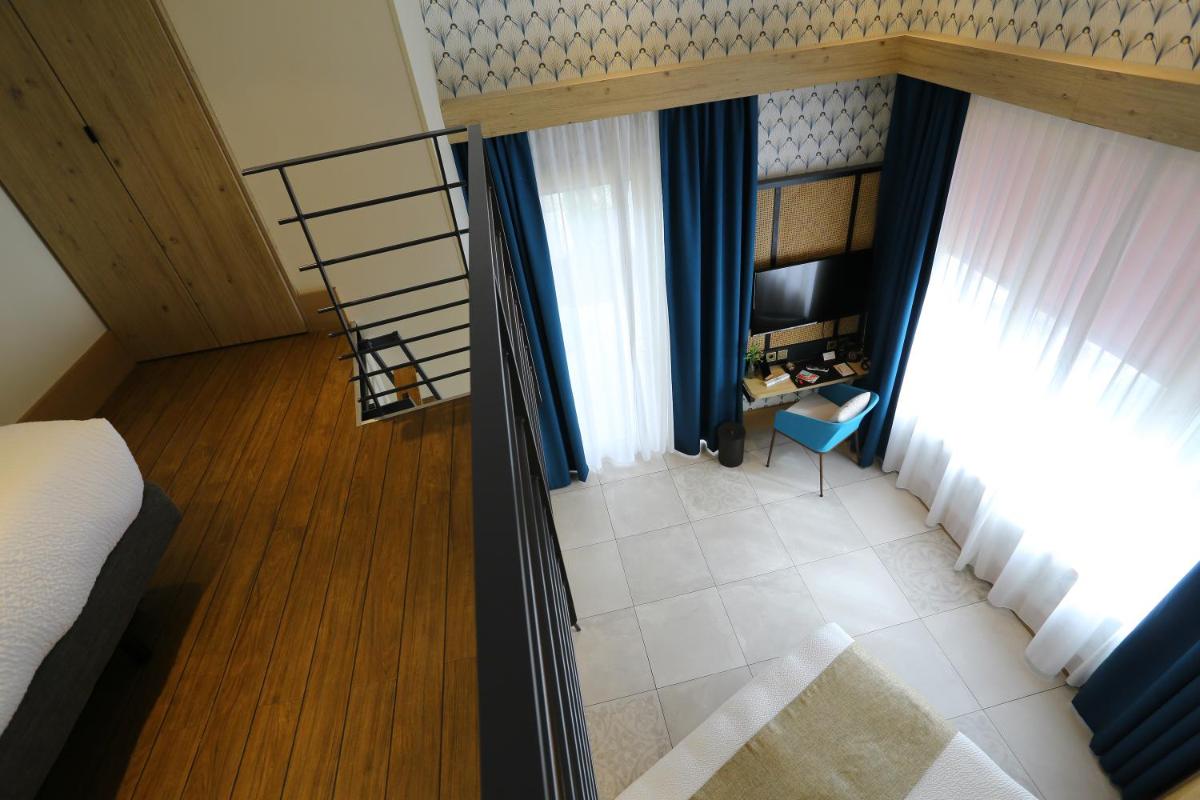 Un ou plusieurs lits dans un hébergement de l'établissement Splendid Hôtel & Spa