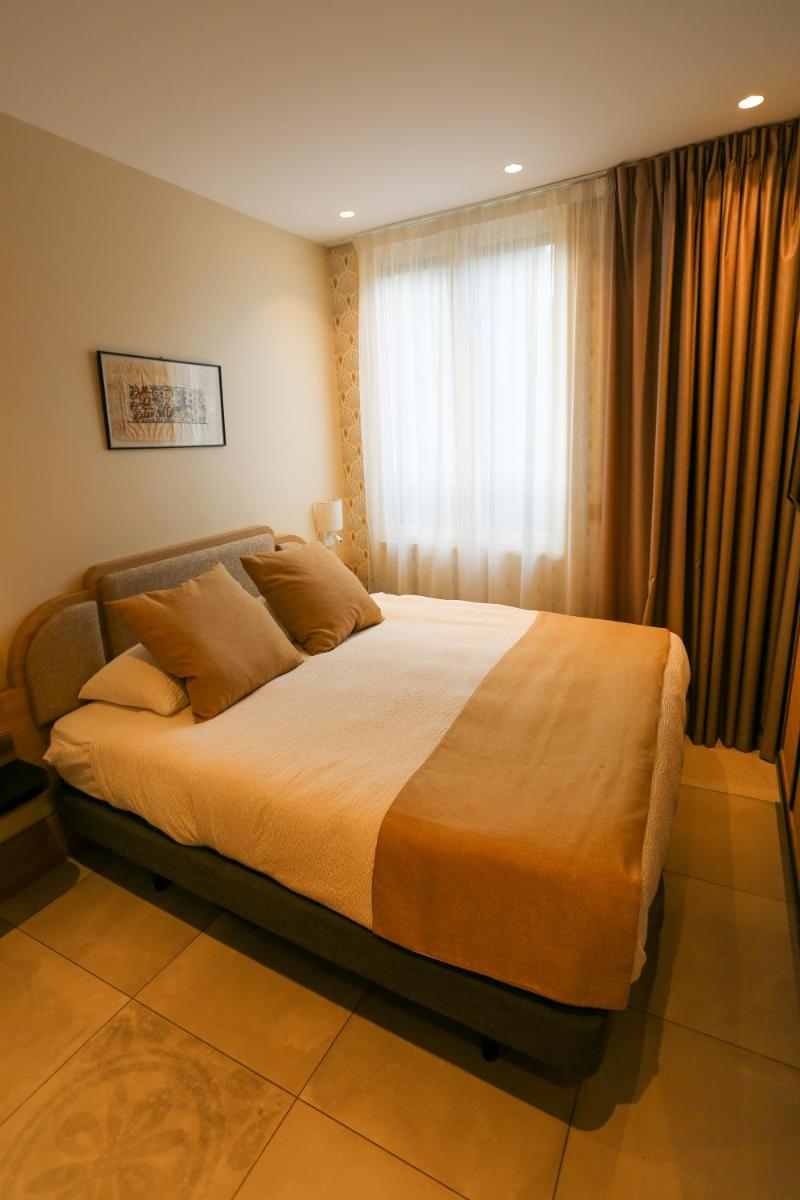 Un ou plusieurs lits dans un hébergement de l'établissement Splendid Hôtel & Spa