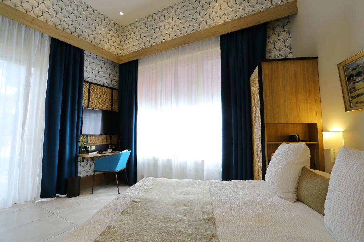 Un ou plusieurs lits dans un hébergement de l'établissement Splendid Hôtel & Spa