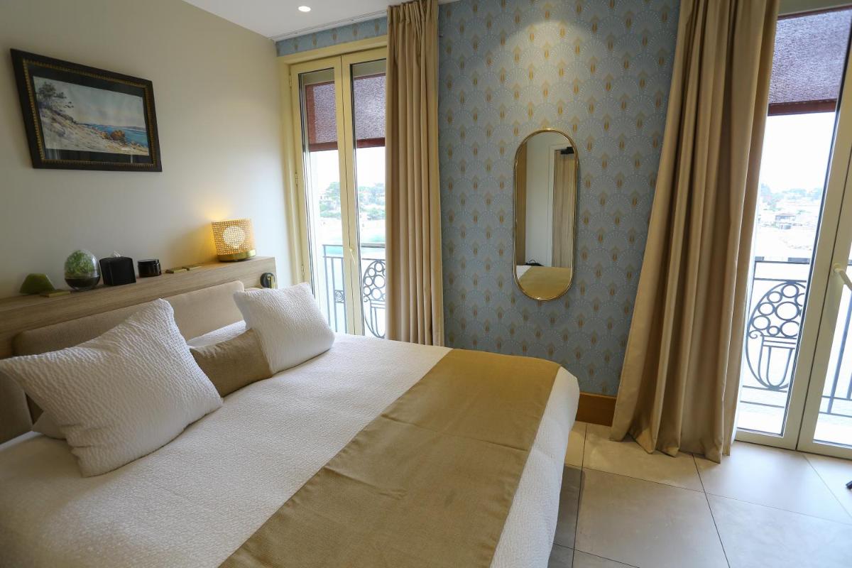 Un ou plusieurs lits dans un hébergement de l'établissement Splendid Hôtel & Spa