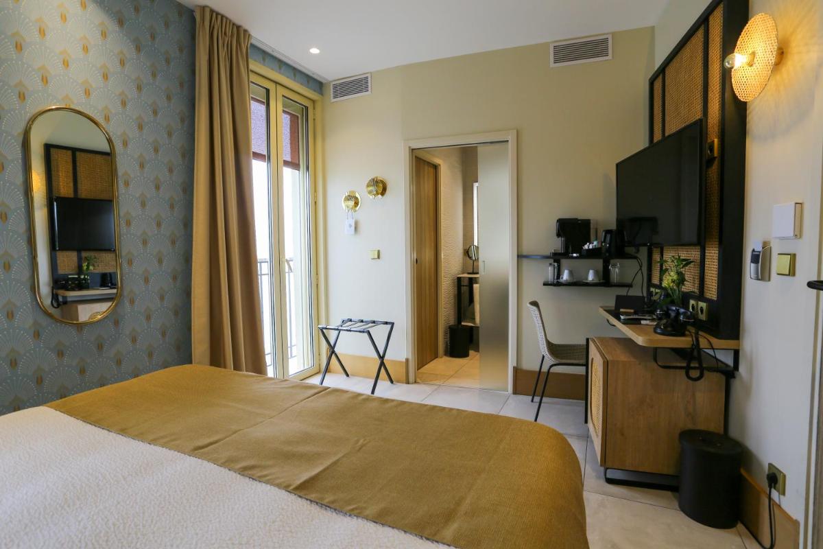 Un ou plusieurs lits dans un hébergement de l'établissement Splendid Hôtel & Spa
