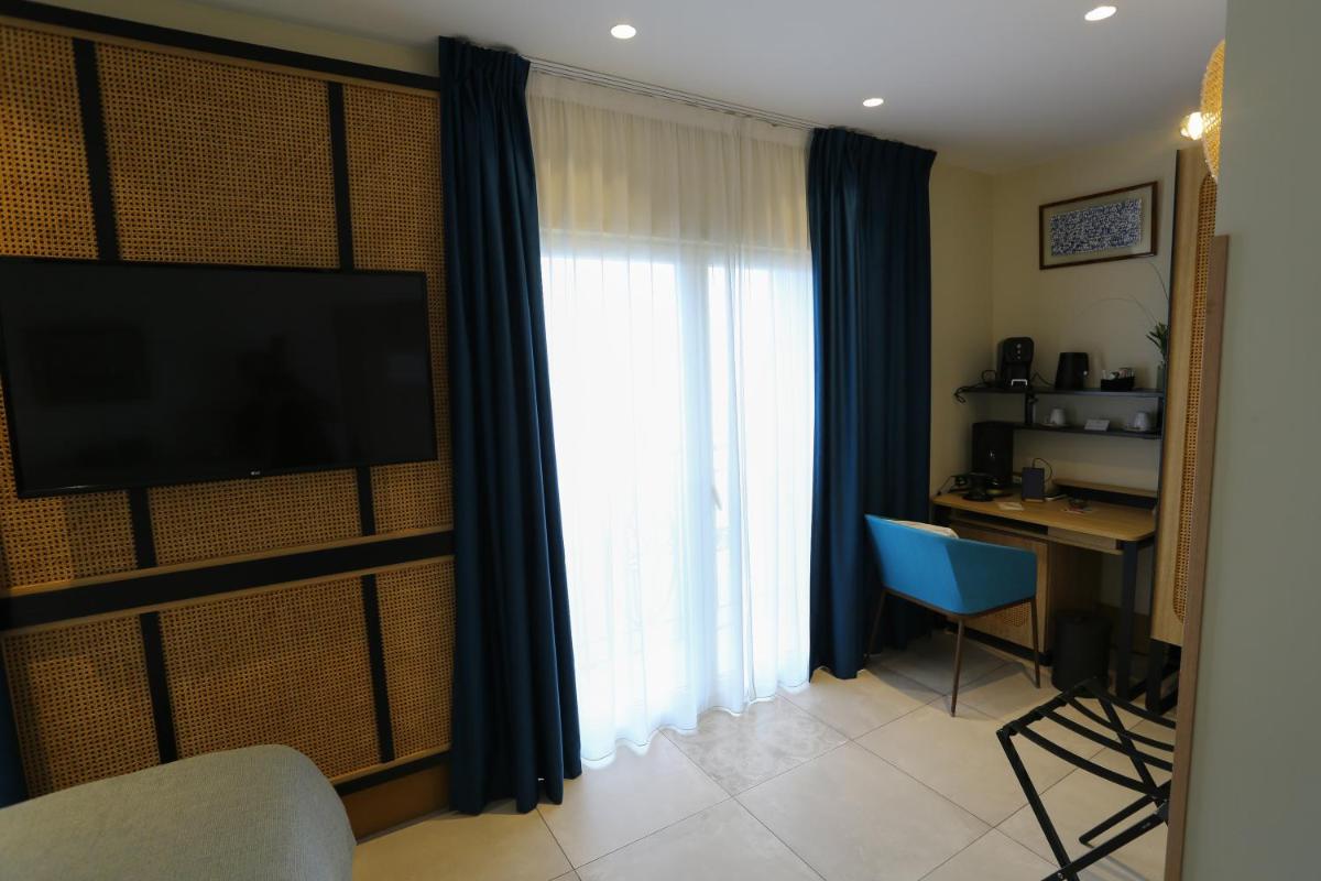 Télévision ou salle de divertissement dans l'établissement Splendid Hôtel & Spa